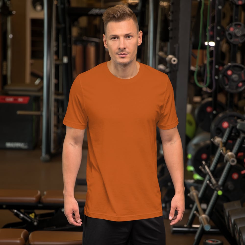 Man wearing Bella Canvas t-shirt in gym setting, personalized custom logo tee for active wear