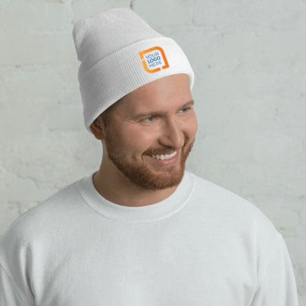 Male model wearing embroidered custom beanie with a custom logo design embroidered on the front